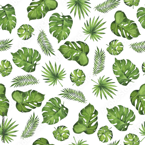 Seamless pattern with wild jungle monstera and palm leaves. Hand drawn watercolor illustration.
