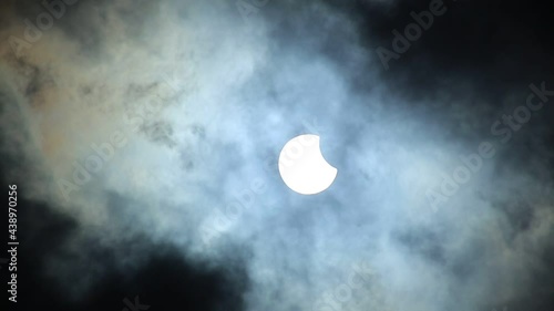Solar eclipse with moving clouds on June 10th 2021
