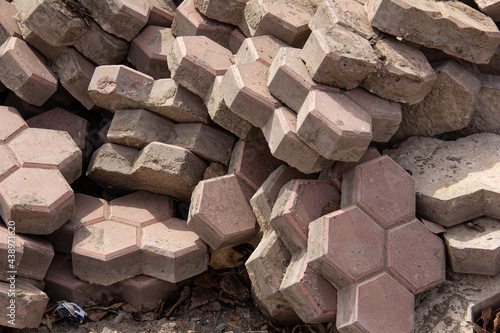 Dismantled old paving slabs piled in a pile.