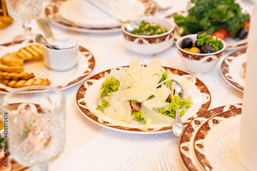 serving a large banquet table in a restaurant or at home for a holiday.