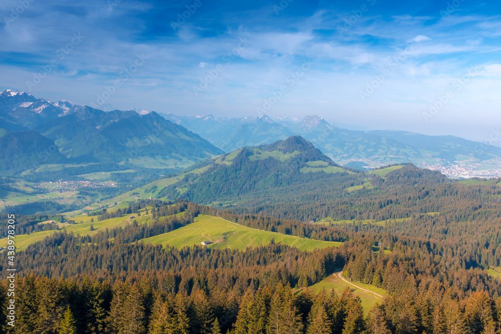 Obraz premium Panoramic landscape view of the Swiss Alpes,with blue sky in the background, shot in La Berra, Gruyère, Switzerland