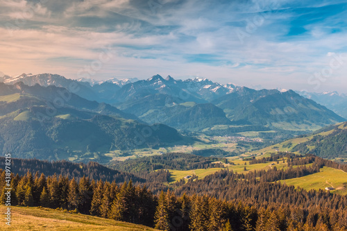 Panoramic landscape view of the Swiss Alpes,with blue sky in the background, shot in La Berra, Gruyère, Switzerland © Eric