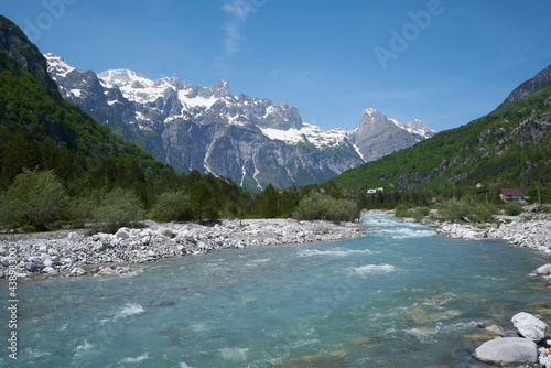 wild river with crystal clear water in theth albanian alps in spring