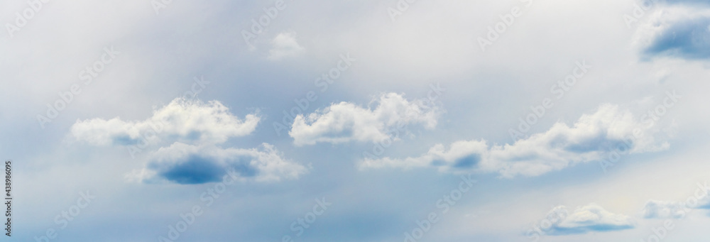 Small fluffy clouds in the sky in cloudy weather, panorama Small fluffy clouds in the sky in cloudy weather, panorama