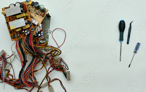 Obraz na płótnie Disassembled power supply of a stationary personal computer on an isolated background. Repair of computer equipment. w salonie