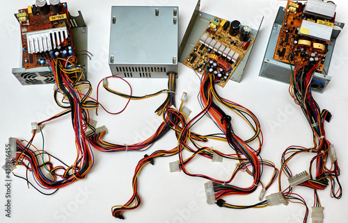 Obraz na płótnie Disassembled power supply of a stationary personal computer on an isolated background. Repair of computer equipment. w salonie