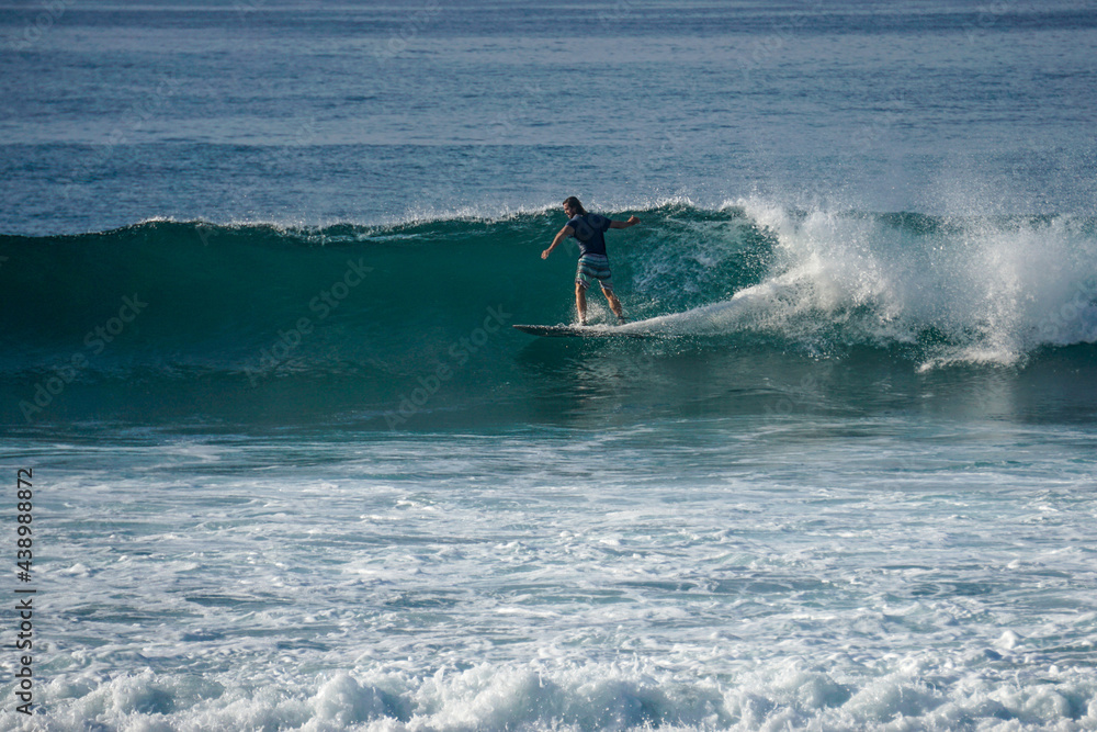 Surfer on perfect blue aquamarine wave, empty line up, perfect for surfing, clean water, Indian Ocean close to Mirissa Surfer on perfect blue aquamarine wave, empty line up, perfect for surfing, clean water, Indian Ocean close to Mirissa