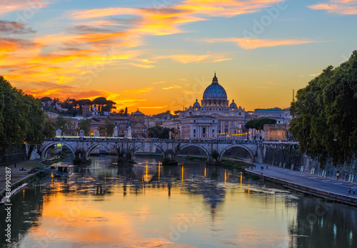 Sunset view of Basilica St Peter, bridge Sant Angelo and river Tiber in Rome. Italy. Architecture and landmark of Rome. Postcard of Rome