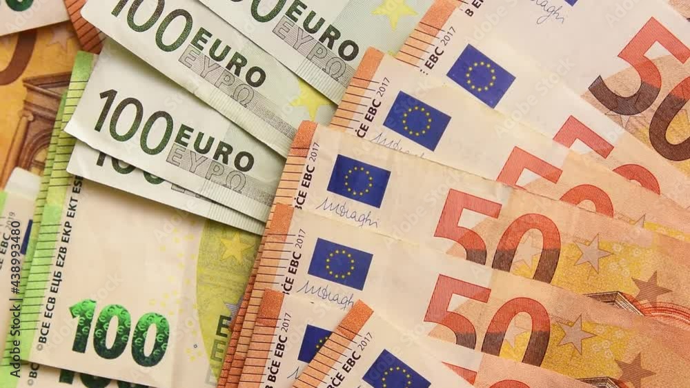 Zoom in Euro Money. Euro cash background. Fifty and one hundred many Euro Money Banknotes Zoom in Euro Money. Euro cash background. Fifty and one hundred many Euro Money Banknotes
