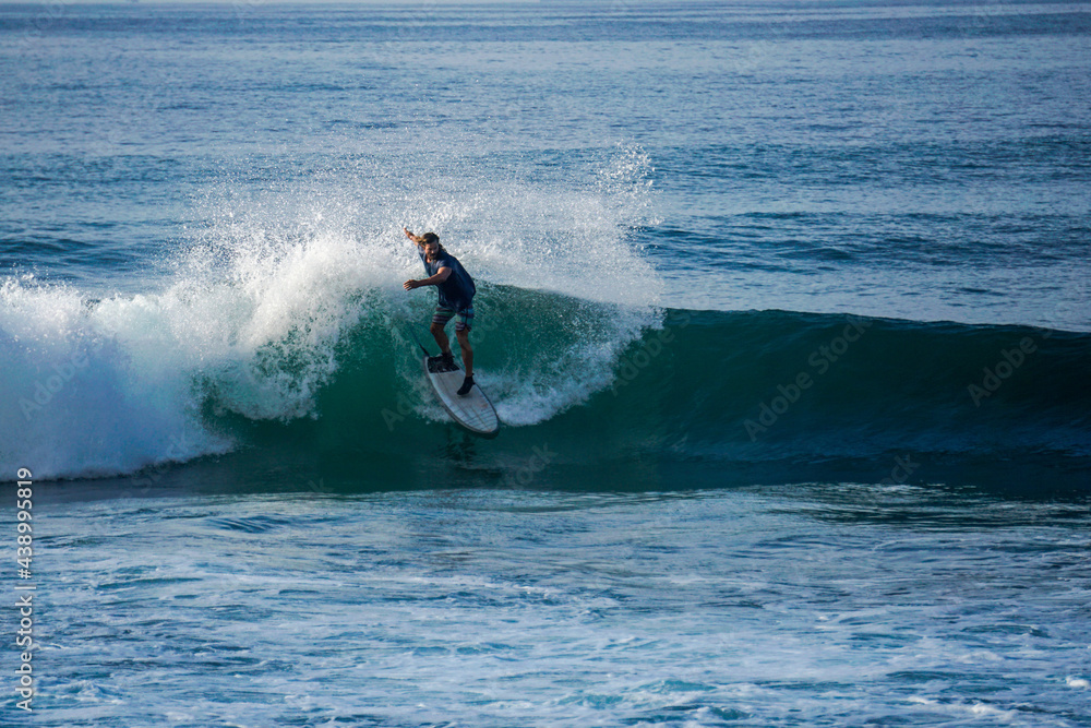 Surfer on perfect blue aquamarine wave, empty line up, perfect for surfing, clean water, Indian Ocean close to Mirissa Surfer on perfect blue aquamarine wave, empty line up, perfect for surfing, clean water, Indian Ocean close to Mirissa