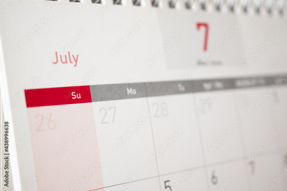 July calendar page with months and dates business planning appointment meeting concept July calendar page with months and dates business planning appointment meeting concept