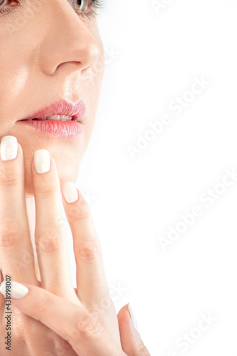 close-up of the lips of a beautiful young woman on a white background