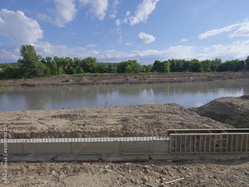 Fototapeta premium building site on a fast river