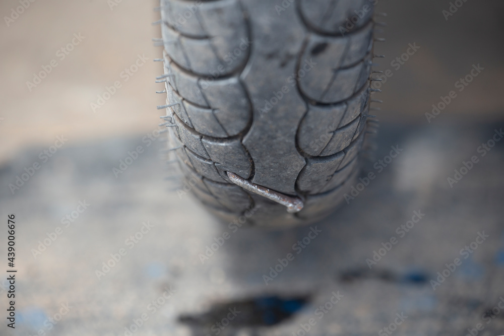 Nail causing the tire to leak. The motorcycle stepped on the nail. Nail causing the tire to leak. The motorcycle stepped on the nail.