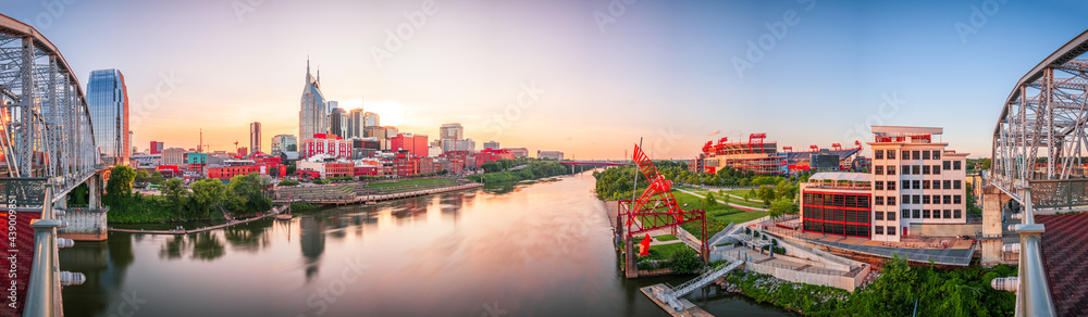 Nashville, Tennessee, USA downtown city skyline at dusk on the Cumberland River.