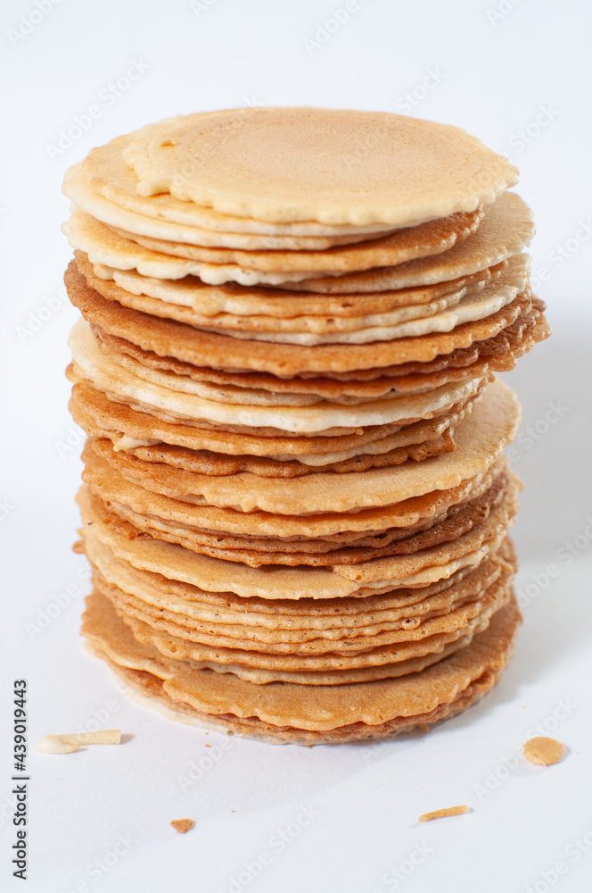 Sembei, a traditional japanese crackers on white table or background and a few crumbs. Sembei, a traditional japanese crackers on white table or background and a few crumbs.