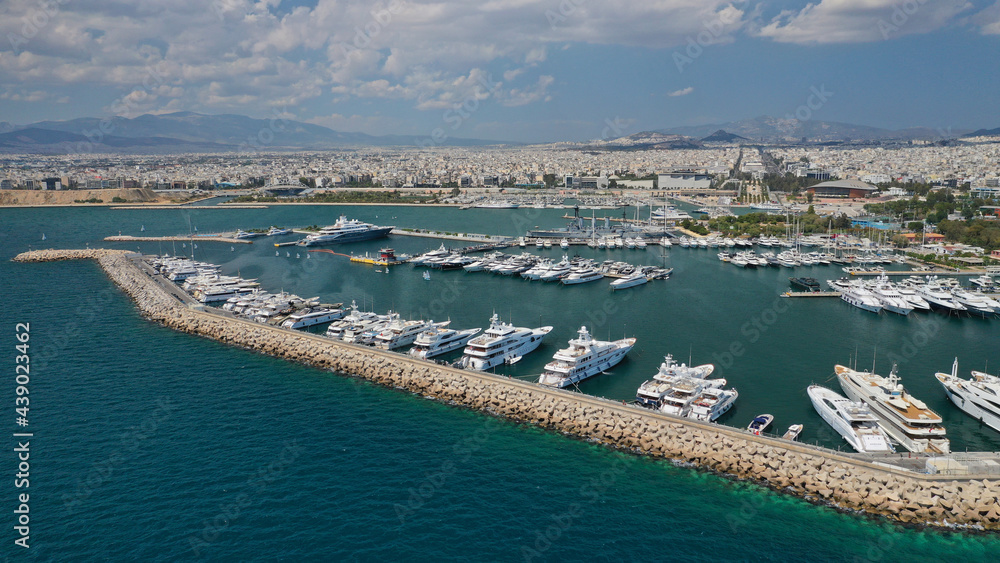 Aerial drone view of famous port of Flisvos with luxury anchored yachts and sail boats, Faliro Marina, Athens riviera, Attica, Greece