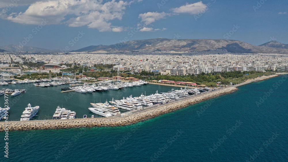 Aerial drone view of famous port of Flisvos with luxury anchored yachts and sail boats, Faliro Marina, Athens riviera, Attica, Greece