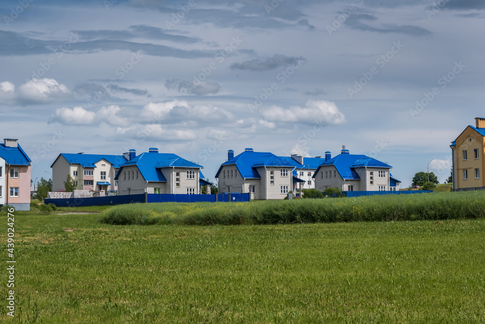 rows of colorful houses in a modern village rows of colorful houses in a modern village
