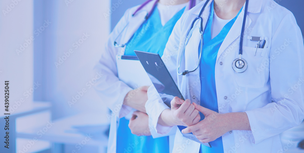 Cropped shoot of two young doctors female with stethoscope.