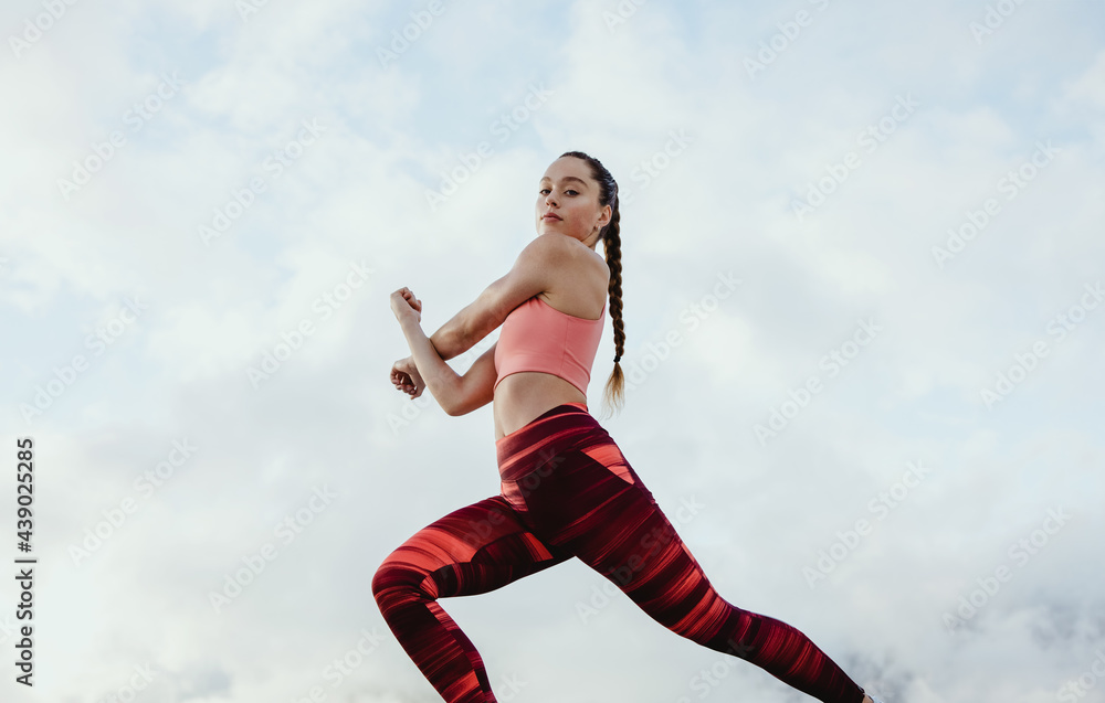 Athlete woman doing warmup stretching workout Athlete woman doing warmup stretching workout