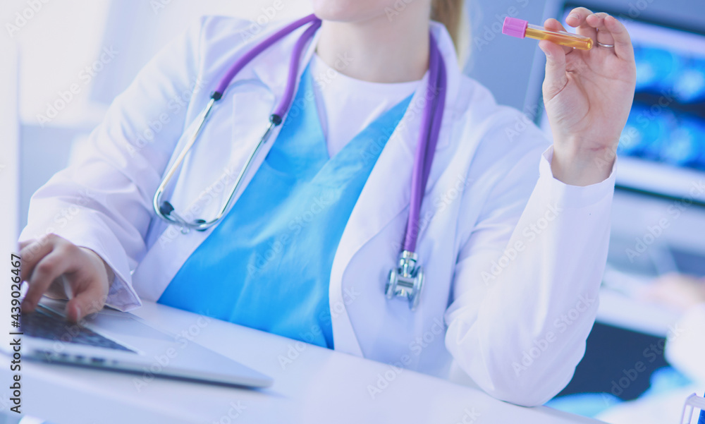 Two young female doctors at medical laboratory with tests. Two young female doctors at medical laboratory with tests.
