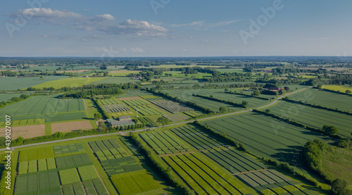 Aerial view of rural landscape with agricultural fields by experimental station.