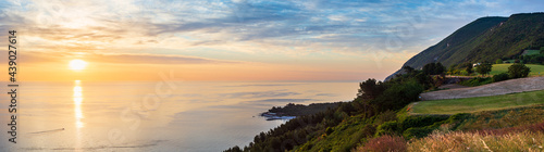 Sunset landscape Conero natural park dramatic coast headland rocky cliff adriatic sea beautiful sky colorful horizon, tourism destination Italy