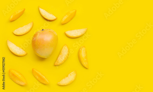 Tropical fruit, Mango on yellow background.