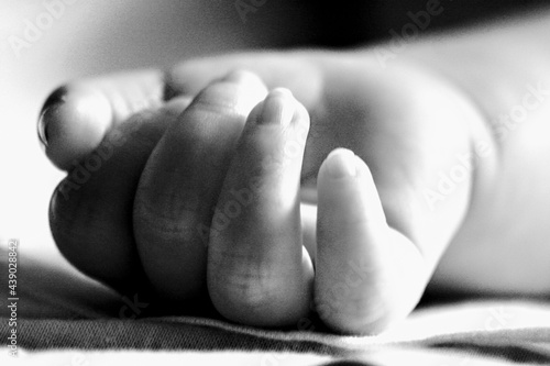 Black and White Newborn Baby Hand - Babies and COVID