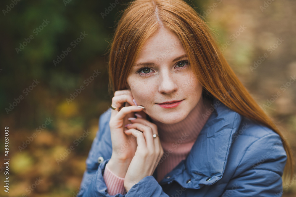A large portrait of a red-haired girl against the background of nature 2748 A large portrait of a red-haired girl against the background of nature 2748