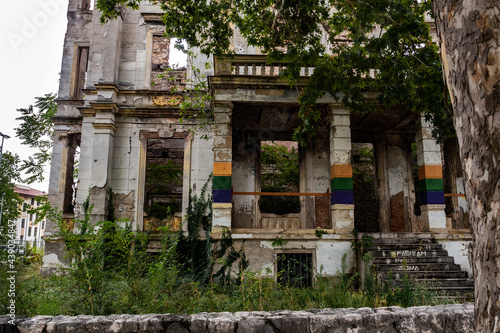 Vegetation taking over a building destroyed by civil war in Mostar, Bosnia and Herzegovina.