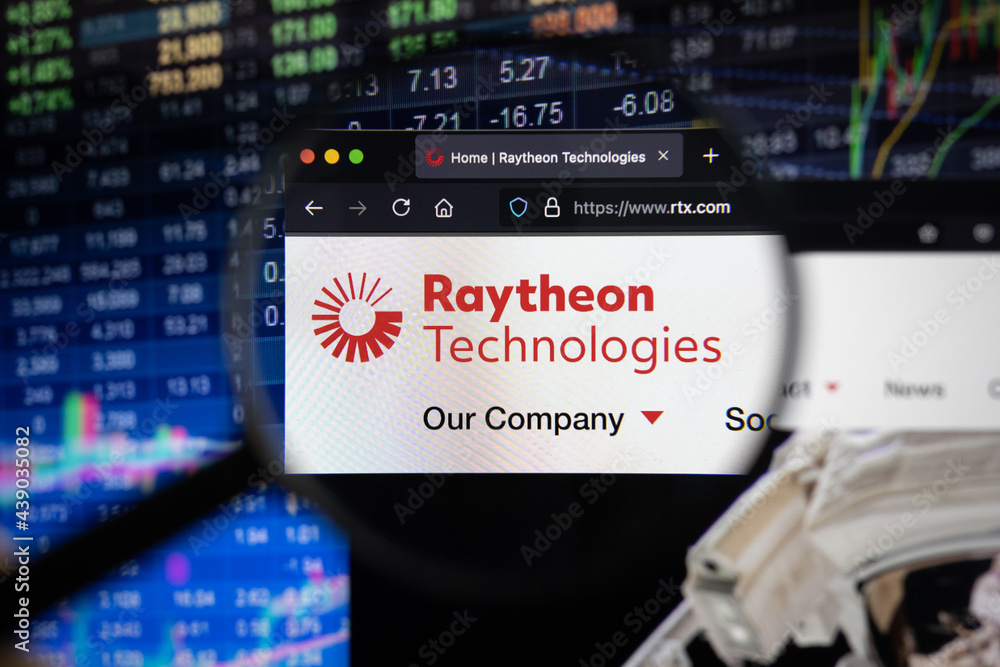 Raytheon Technologies company logo on a website with blurry stock ...