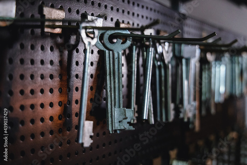 фотографія Row of hanging keys in key duplication workshop