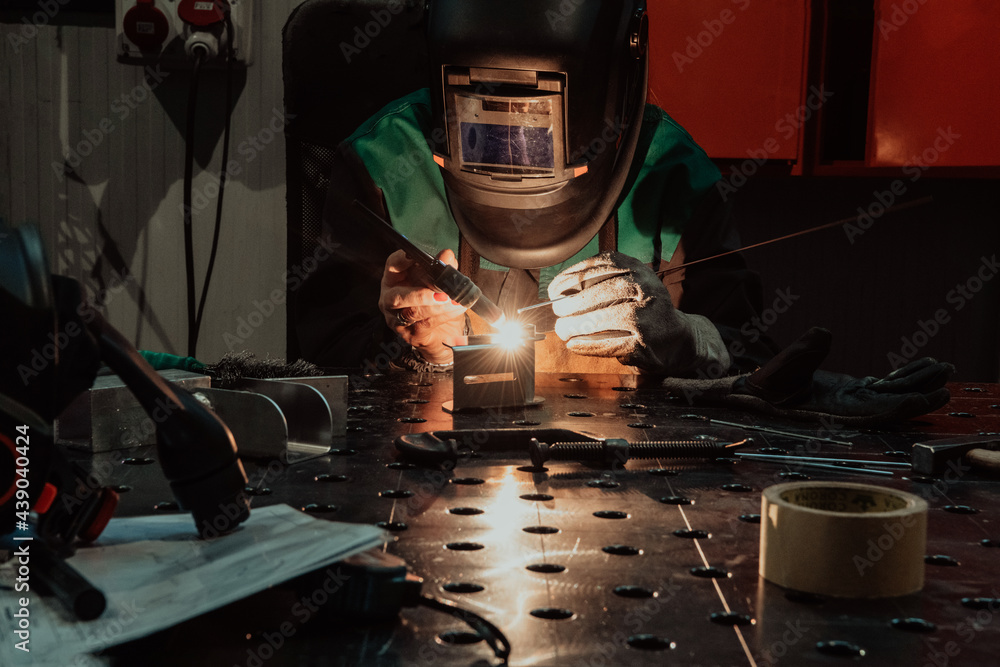 Ταπετσαρία A woman employed in a modern factory for the production and processing of metals
