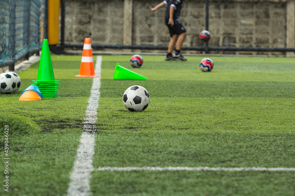 Soccer ball tactics on grass field with cone Soccer ball tactics on grass field with cone