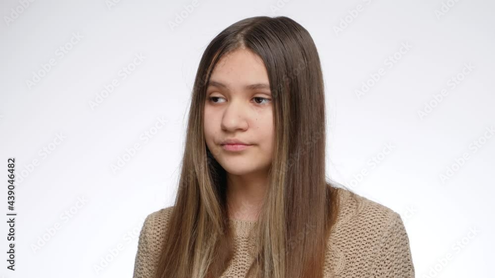 Portrait of displeased girl rolling up her eyes and shaking head Portrait of displeased girl rolling up her eyes and shaking head