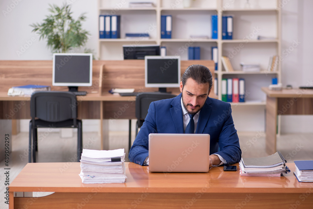 Young businessman employee working at workplace Young businessman employee working at workplace