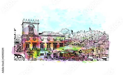 Building view with landmark of Guimaraes is a city in northern Portugal. Watercolor splash with hand drawn sketch illustration in vector.