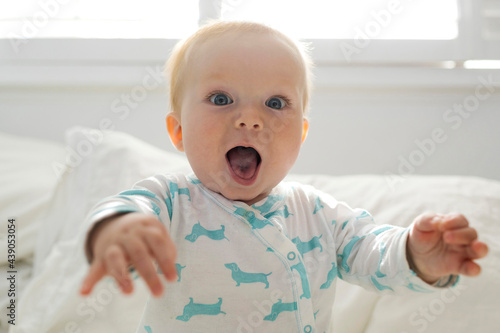 Portrait of baby boy with open mouth photo