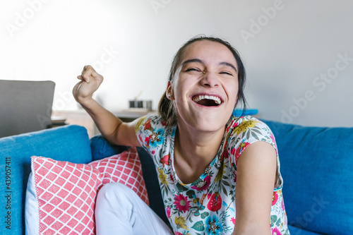 portrait of  hispanic disabled girl with cerebral palsy smiling at Home in disability concept in Latin America photo