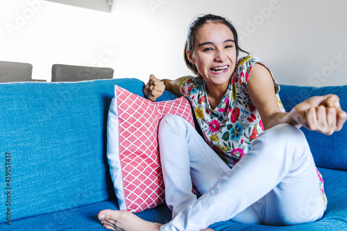 portrait of latin disabled girl with cerebral palsy smiling at Home in disability concept in Latin America