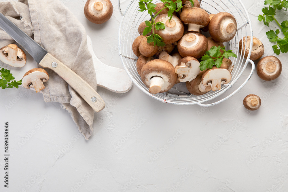 Champinion mushrooms on light background. Vegan food concept.