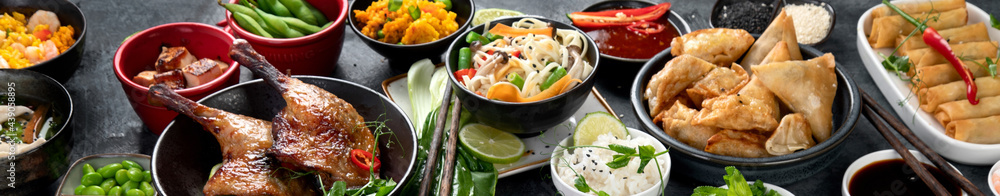 Assorted Chinese dishes and snacks on dark gray background. Traditional food concept. Assorted Chinese dishes and snacks on dark gray background. Traditional food concept.