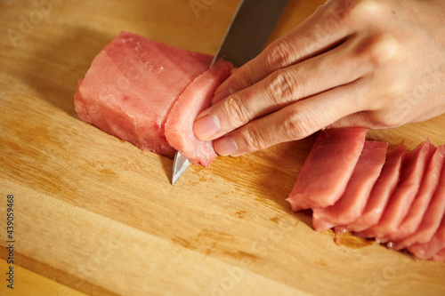 Cutting fresh tuna with a sashimi knife