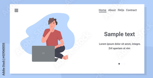 young man freelancer working on laptop coronavirus pandemic quarantine self isolation concept full length horizontal copy space