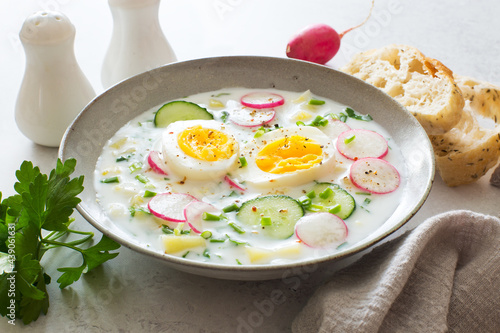 Refresing cold summer radish, cucumber,potato , eggs and yogurt soup close up photo