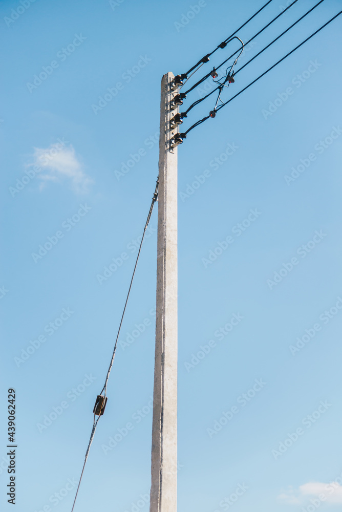 Single electric pole and cable with blue sky for background concept idea Single electric pole and cable with blue sky for background concept idea