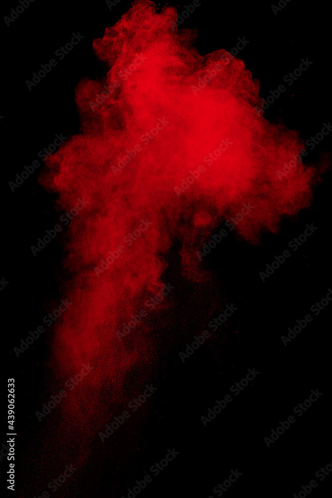 Red powder explosion cloud on black background. Red powder explosion cloud on black background.