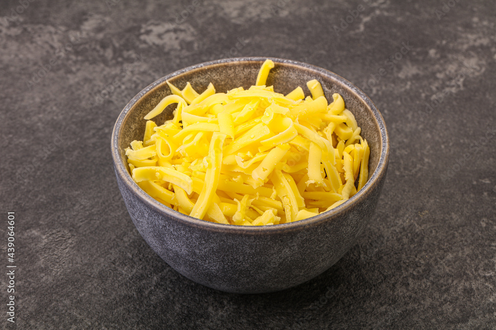 Shredded yellow cheese in the bowl Shredded yellow cheese in the bowl